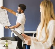 black-man-showing-blueprint-woman