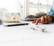 Hands of Engineer working on blueprint,Construction concept. Engineering tools.Vintage tone retro filter effect,soft focus(selective focus)